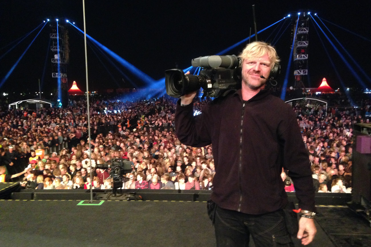 Kjeld Friis on Orange stage with broadcast camera